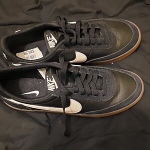 Nike Black Low-Top Sneakers with White Swoosh and Gum Sole